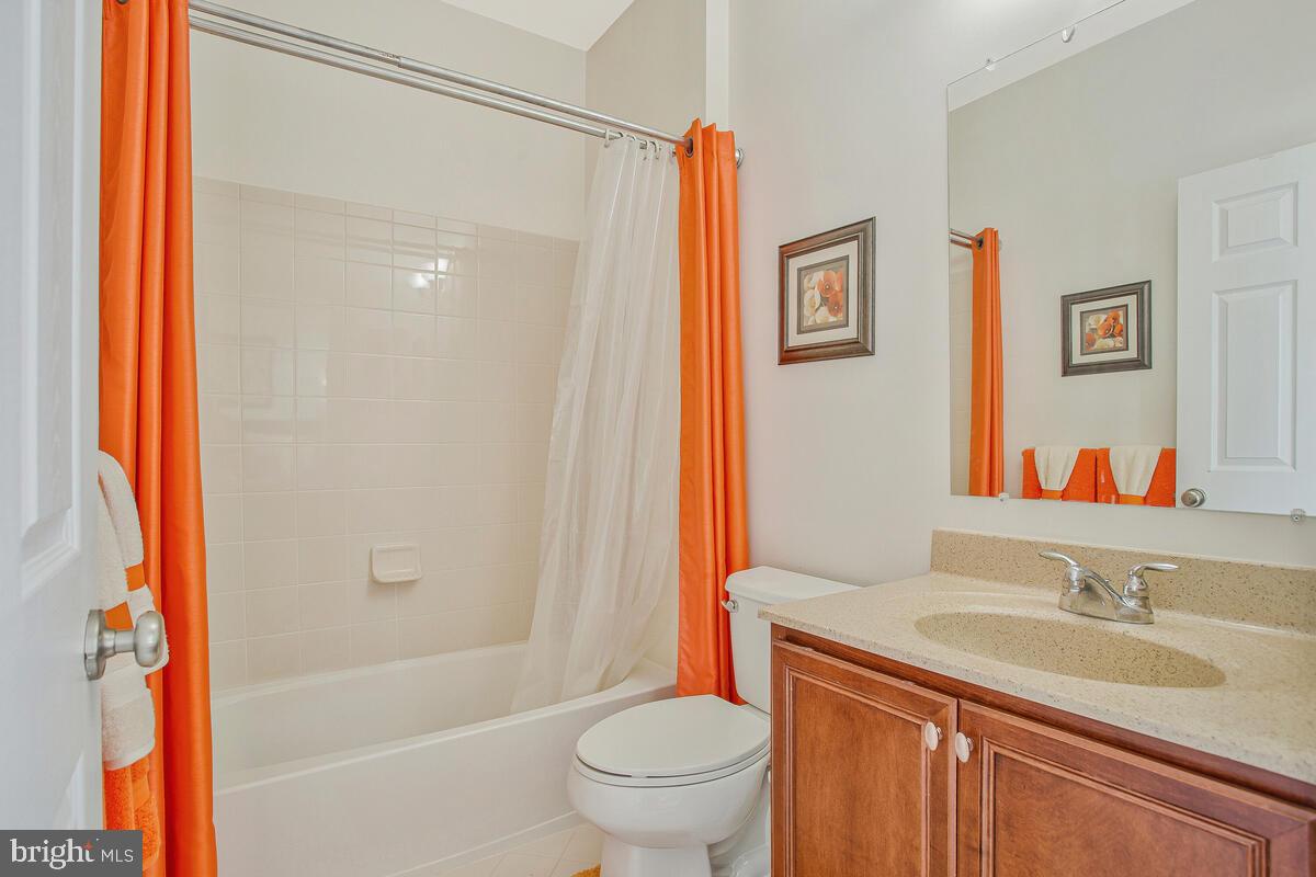 4006 Bridle Ridge Road Upper Marlboro, MD 20772 - Photo 30 of 45 a bathroom with a granite countertop sink toilet and shower