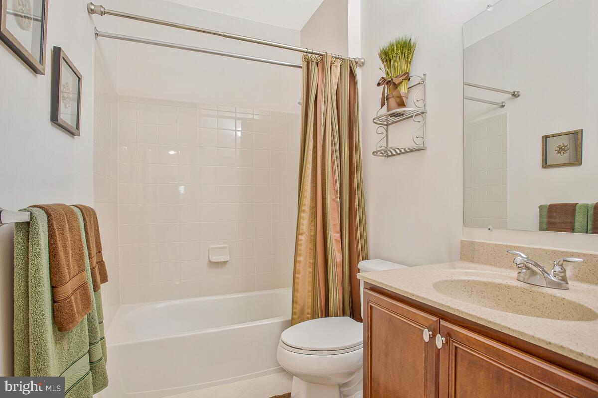 4006 Bridle Ridge Road Upper Marlboro, MD 20772 - Photo 31 of 45 a bathroom with a granite countertop sink toilet and shower