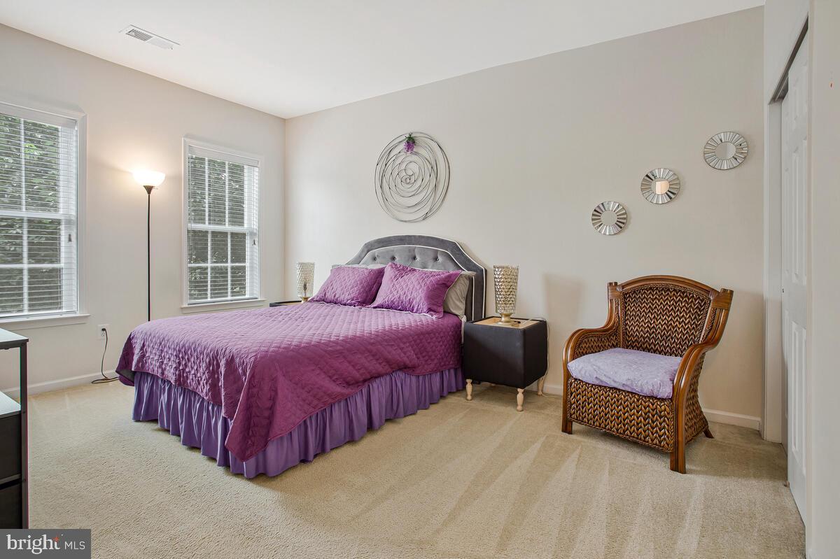 4006 Bridle Ridge Road Upper Marlboro, MD 20772 - Photo 32 of 45 a bedroom with a bed and chair