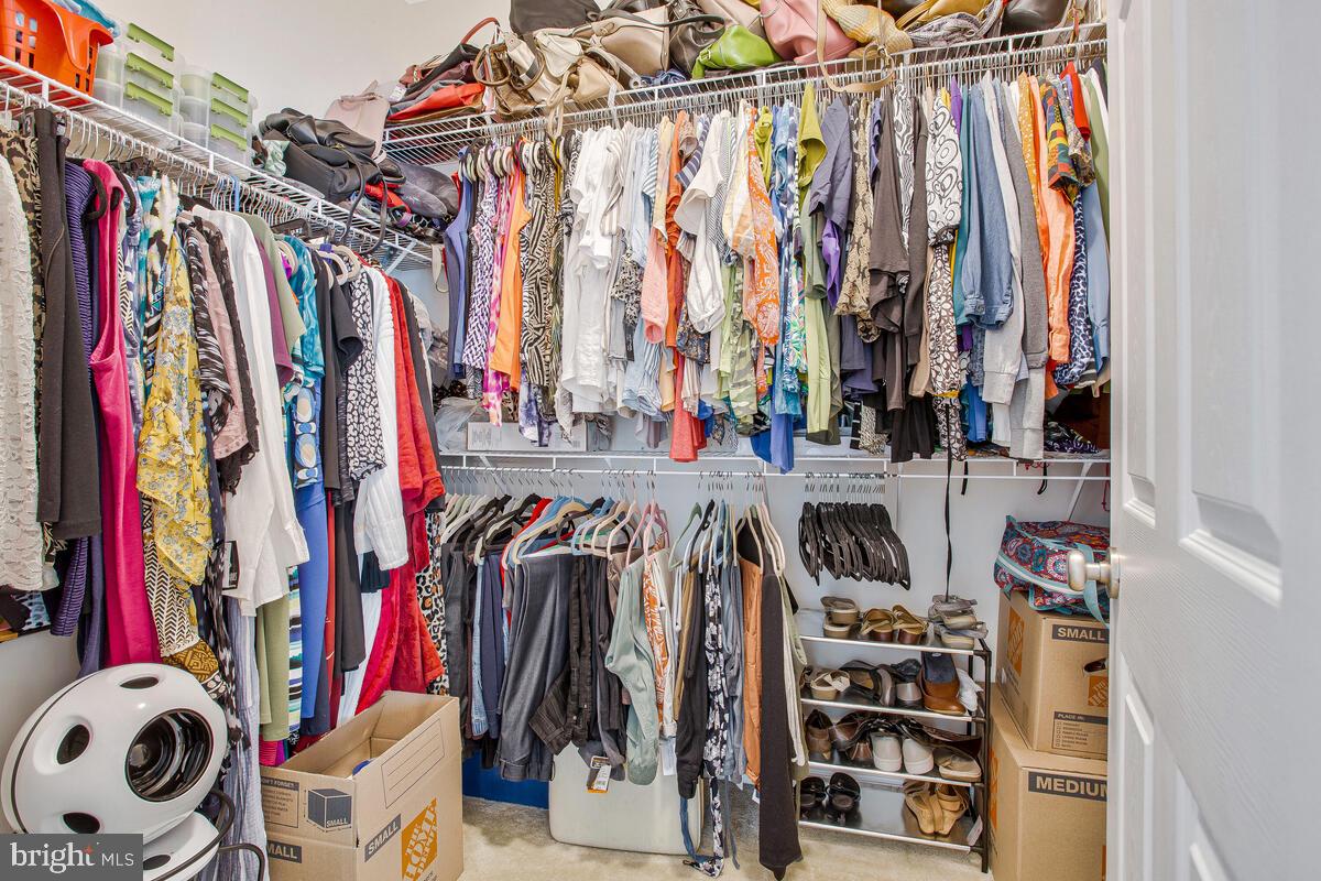 4006 Bridle Ridge Road Upper Marlboro, MD 20772 - Photo 36 of 45 a view of walk in closet with clothes