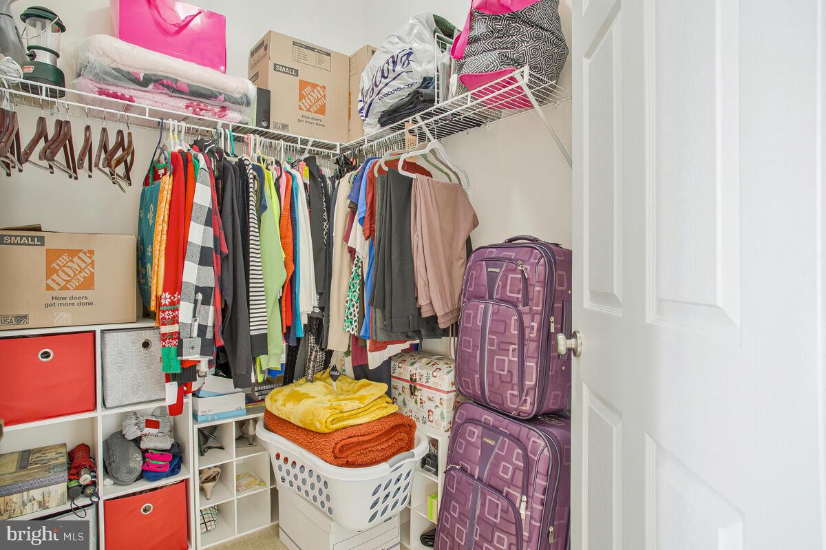 4006 Bridle Ridge Road Upper Marlboro, MD 20772 - Photo 37 of 45 a view of walk in closet with clothes
