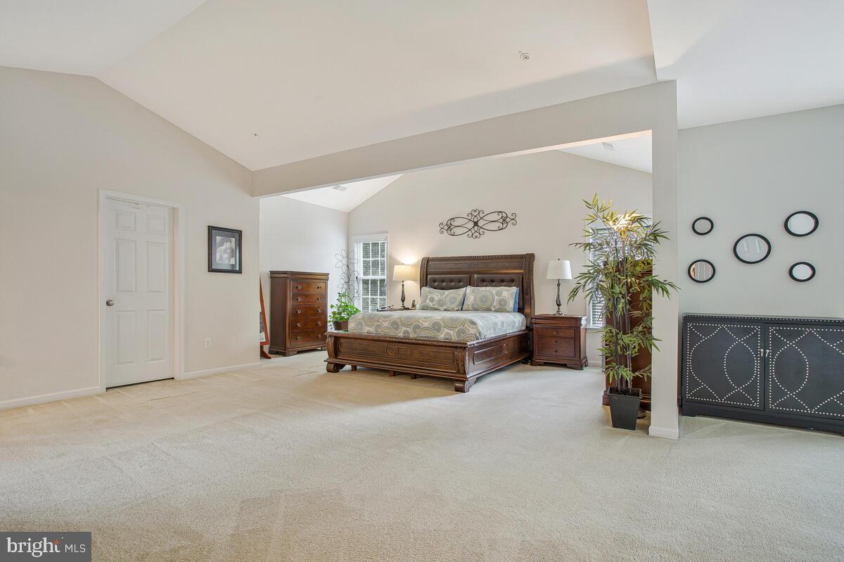 4006 Bridle Ridge Road Upper Marlboro, MD 20772 - Photo 39 of 45 a bedroom with furniture and a fireplace