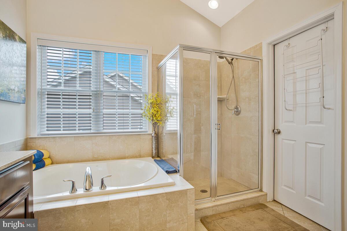 4006 Bridle Ridge Road Upper Marlboro, MD 20772 - Photo 42 of 45 a bathroom with a bathtub and a shower