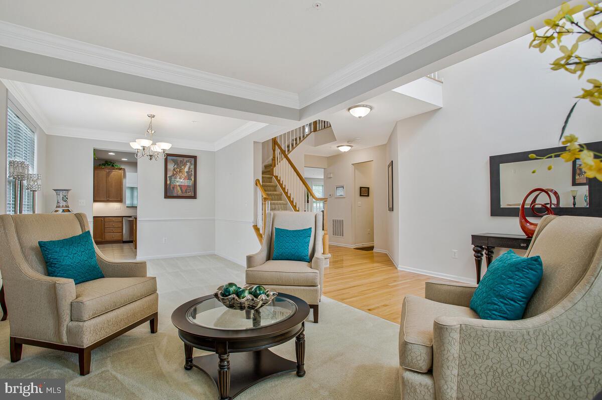 4006 Bridle Ridge Road Upper Marlboro, MD 20772 - Photo 6 of 45 a living room with furniture and a wooden floor