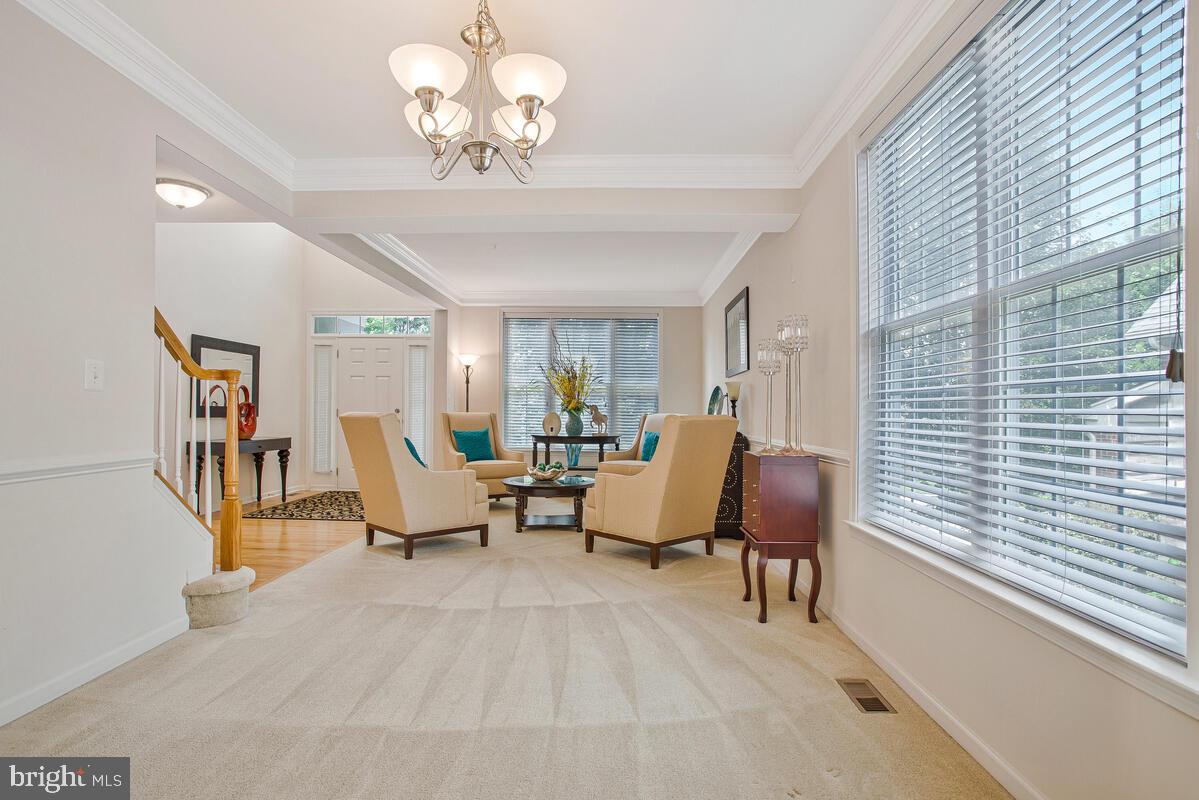 4006 Bridle Ridge Road Upper Marlboro, MD 20772 - Photo 9 of 45 a living room with furniture chandelier and a window
