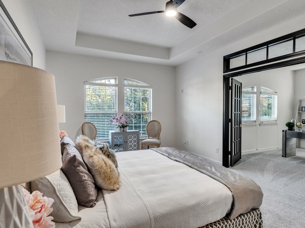 2523 Watts Street Houston, TX 77030 - Photo 31 of 45 a bedroom with a bed and a chandelier