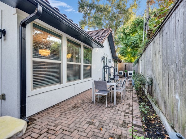 2523 Watts Street Houston, TX 77030 - Photo 44 of 45 a view of a patio with table and chairs and wooden floor
