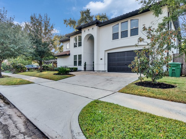 2523 Watts Street Houston, TX 77030 - Photo 45 of 45 a front view of a house with a yard and garage