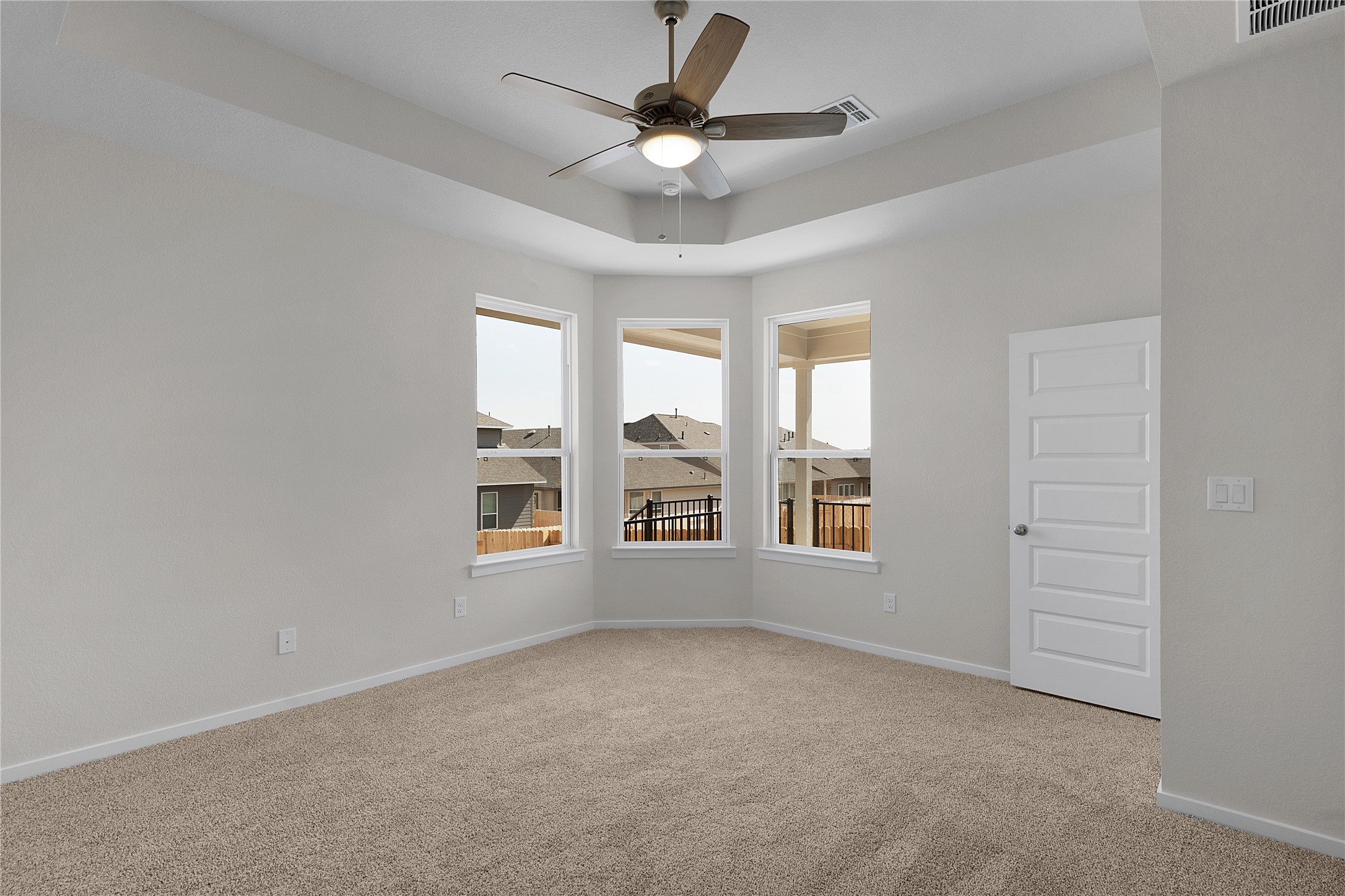 205 Blue Vervain Trail Georgetown, TX 78633 - Photo 10 of 27 an empty room with windows and ceiling fan