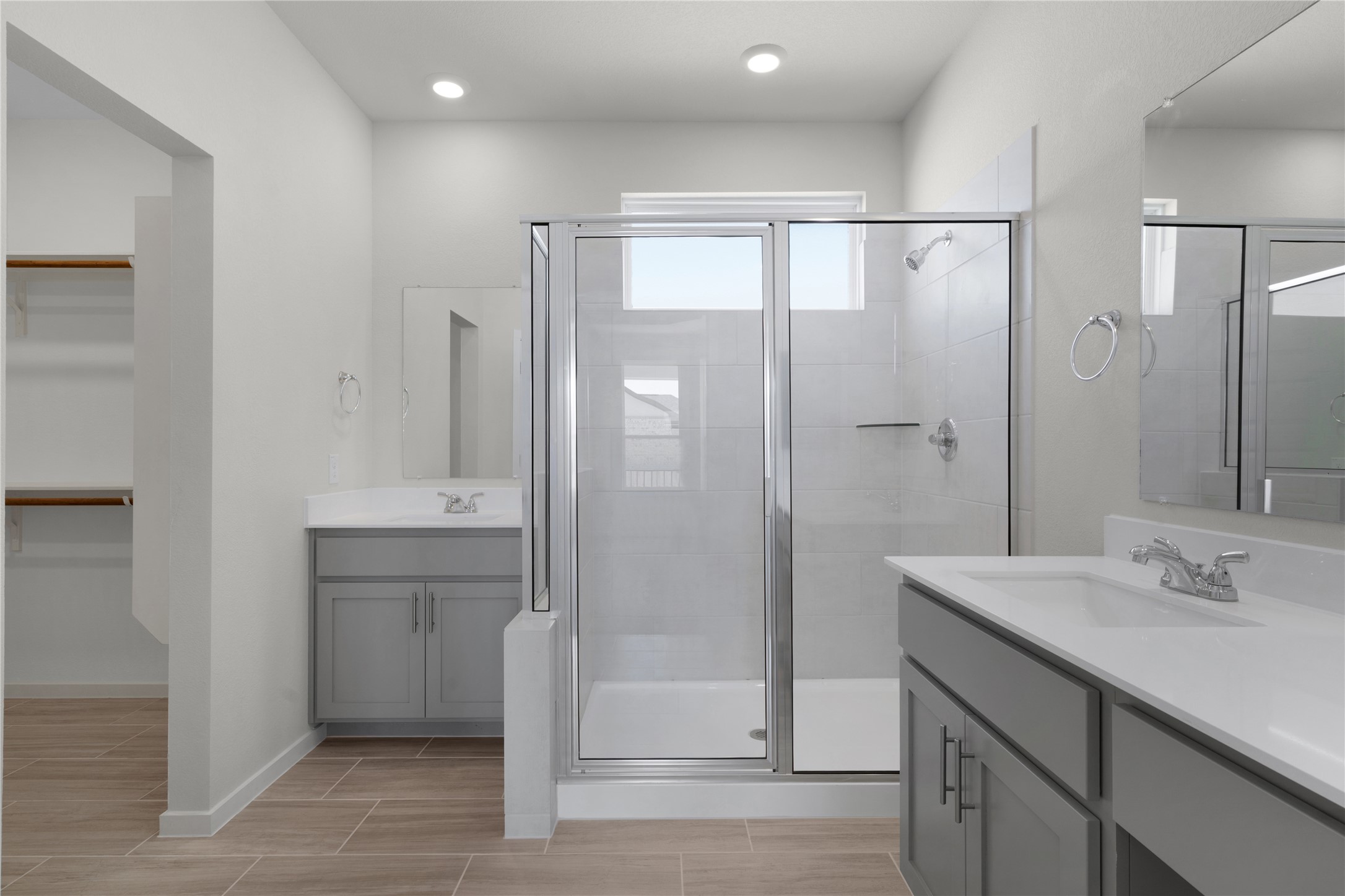 205 Blue Vervain Trail Georgetown, TX 78633 - Photo 11 of 27 a bathroom with a shower sink and mirror