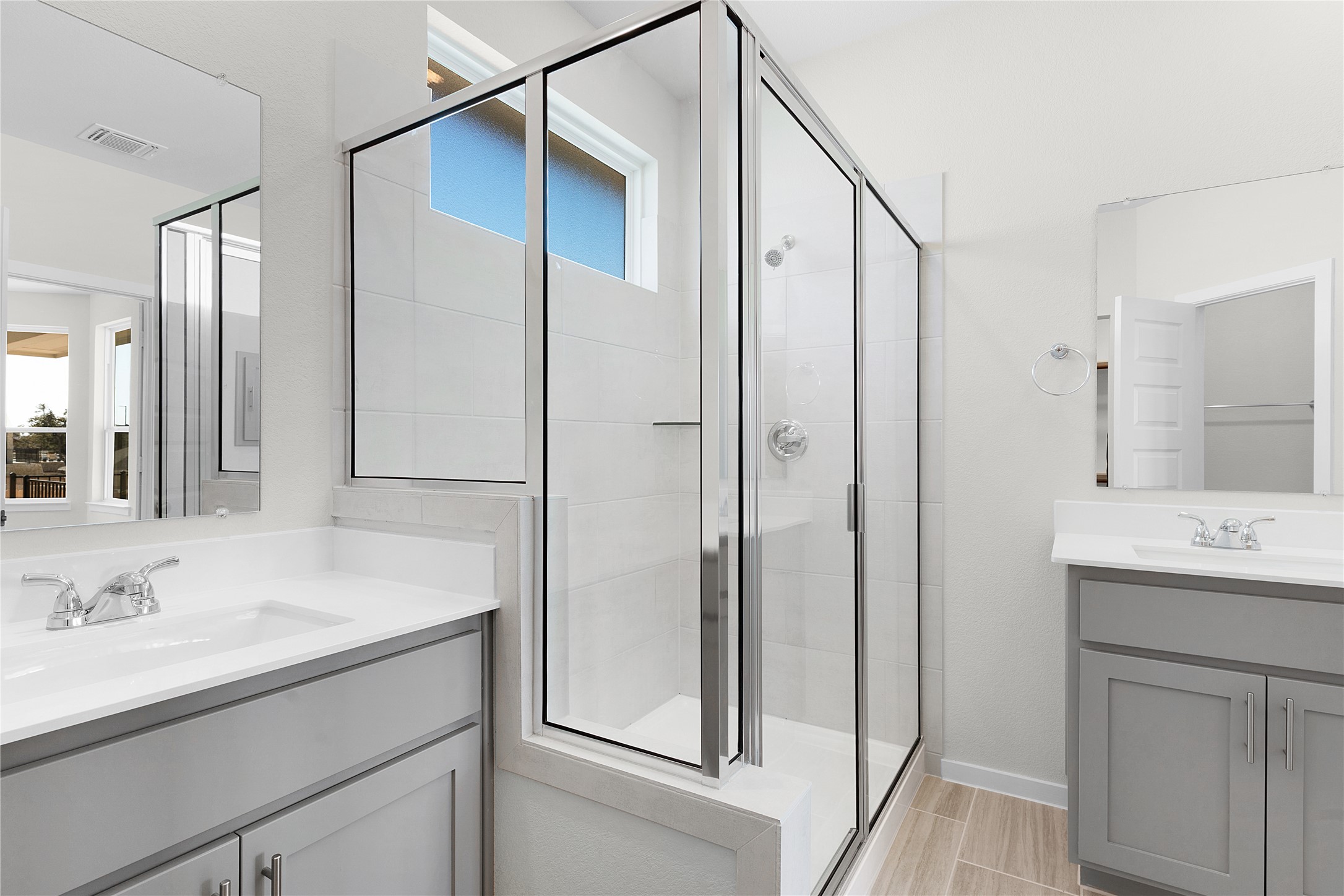 205 Blue Vervain Trail Georgetown, TX 78633 - Photo 13 of 27 a bathroom with a shower sink vanity and mirror