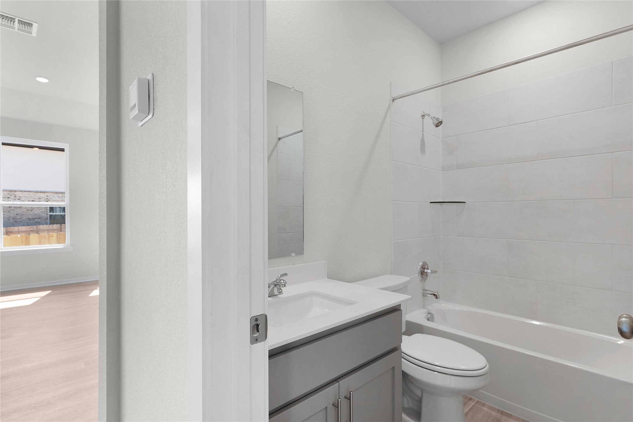 205 Blue Vervain Trail Georgetown, TX 78633 - Photo 14 of 27 a bathroom with a sink toilet vanity and shower