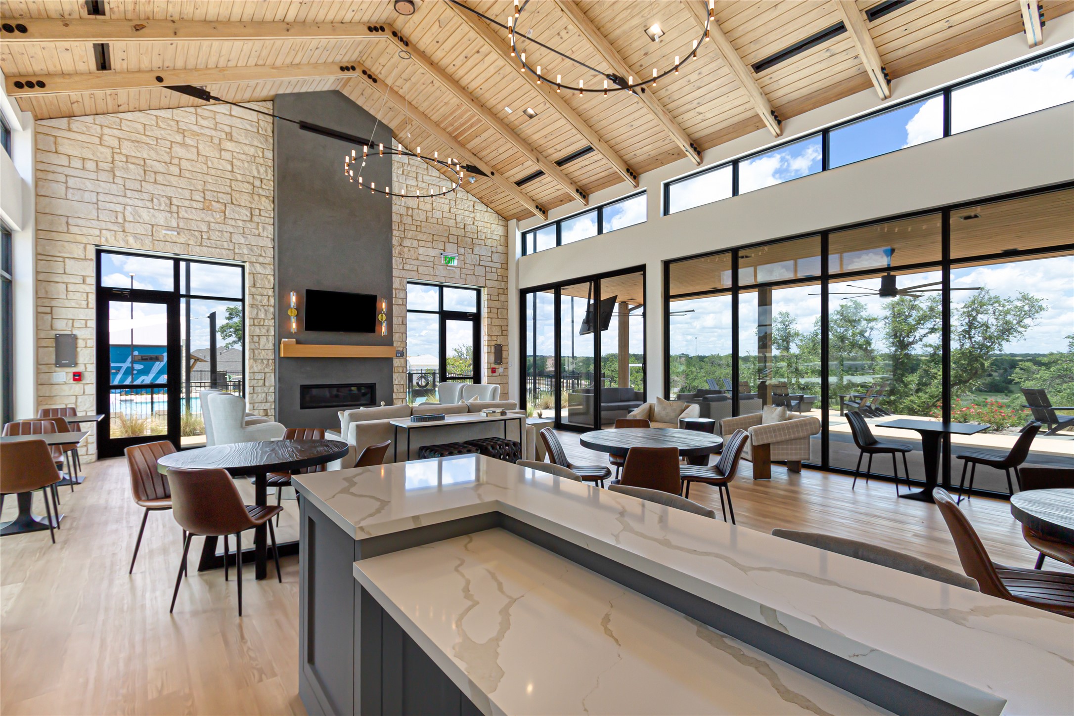 205 Blue Vervain Trail Georgetown, TX 78633 - Photo 27 of 27 a view of a dining room with furniture large windows and wooden floor
