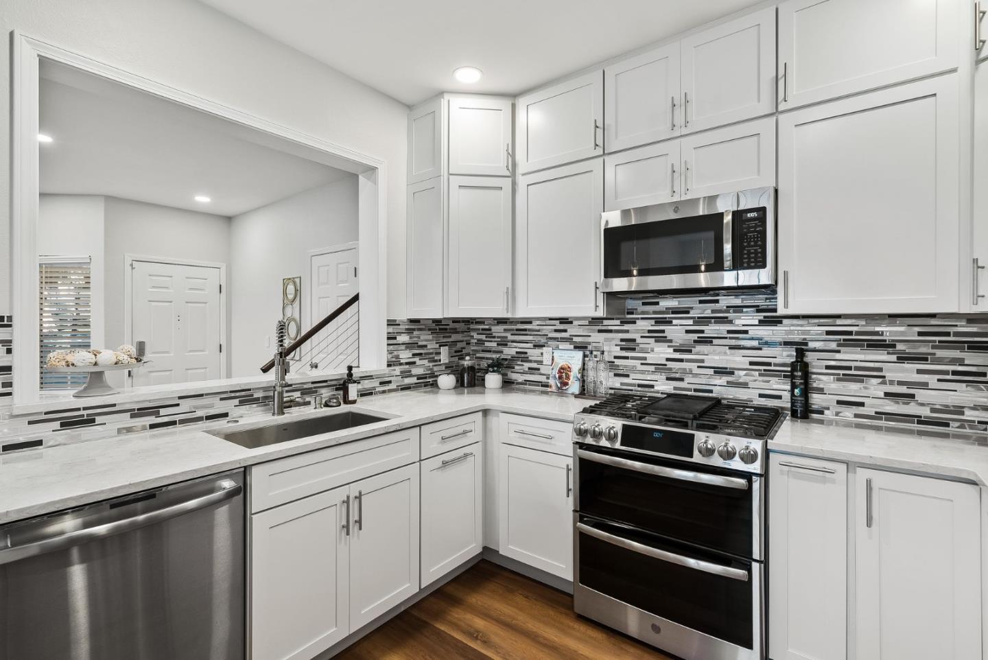 300 Troon Way Half Moon Bay, CA 94019 - Photo 15 of 50 a kitchen with appliances a sink and cabinets