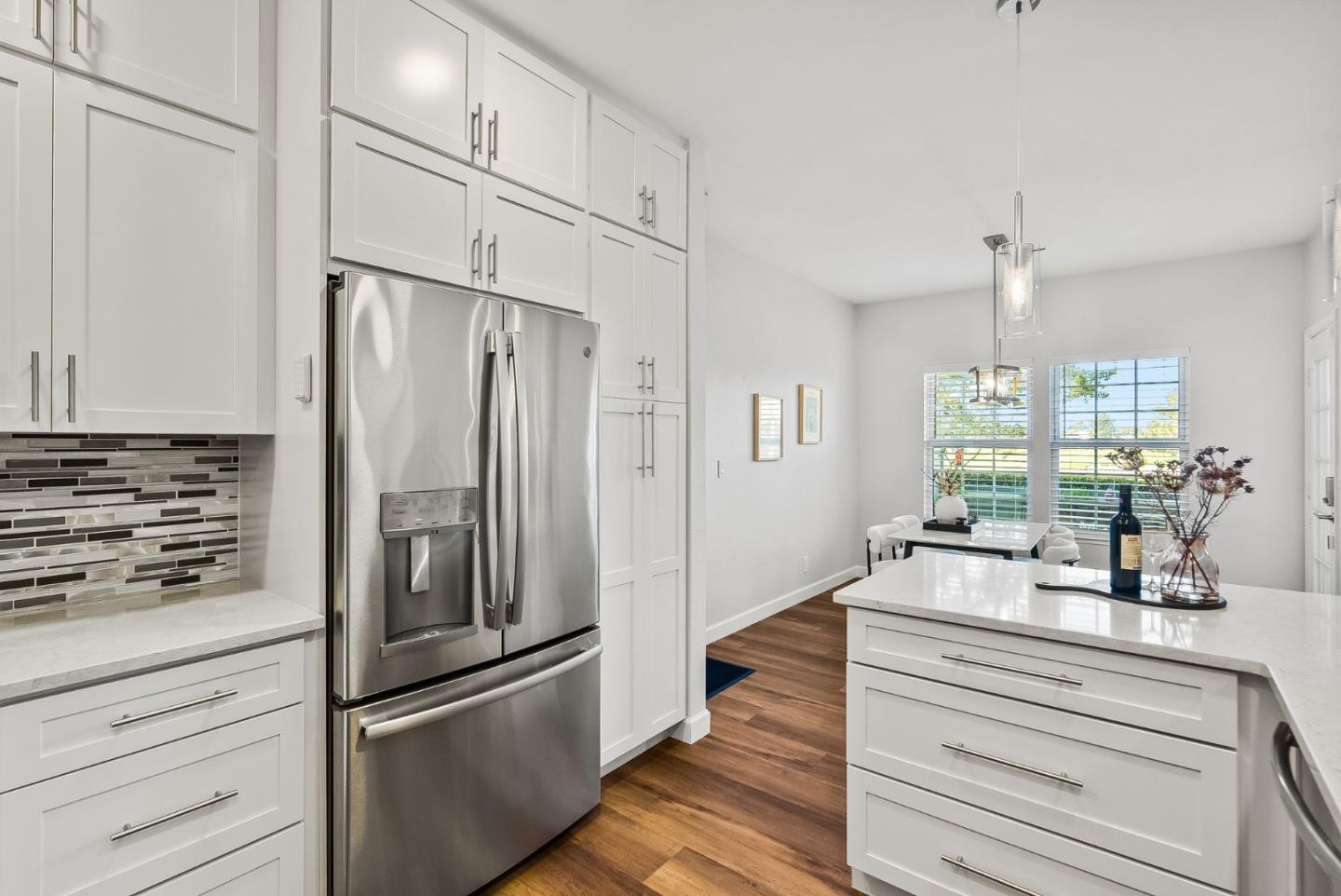 300 Troon Way Half Moon Bay, CA 94019 - Photo 16 of 50 a kitchen with kitchen island a counter top space stainless steel appliances and windows