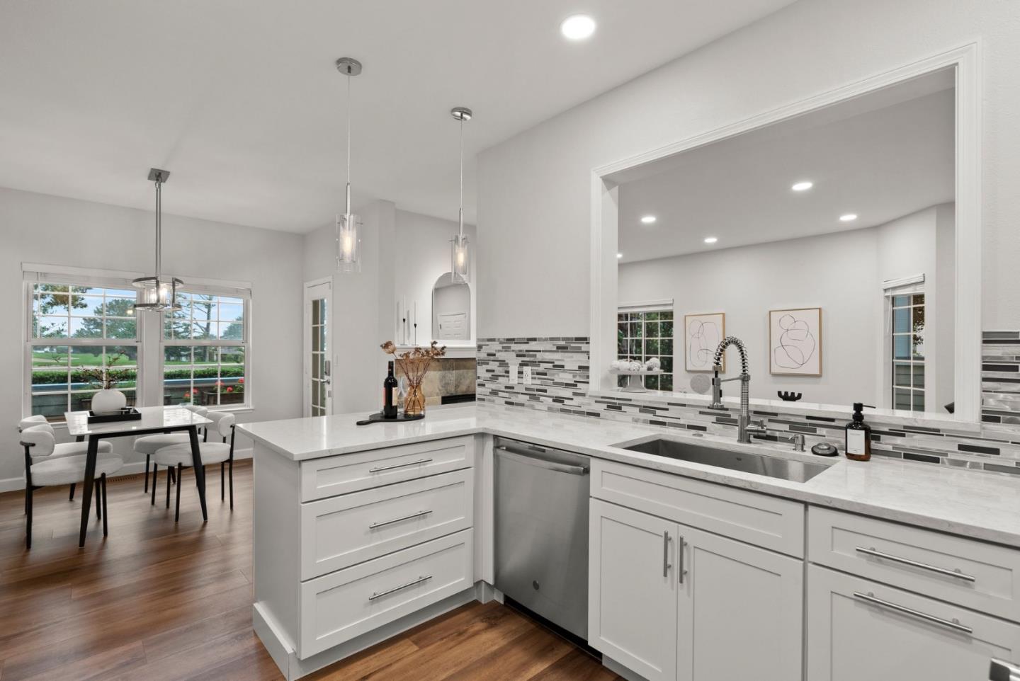 300 Troon Way Half Moon Bay, CA 94019 - Photo 17 of 50 a kitchen with a sink white cabinets and wooden floor