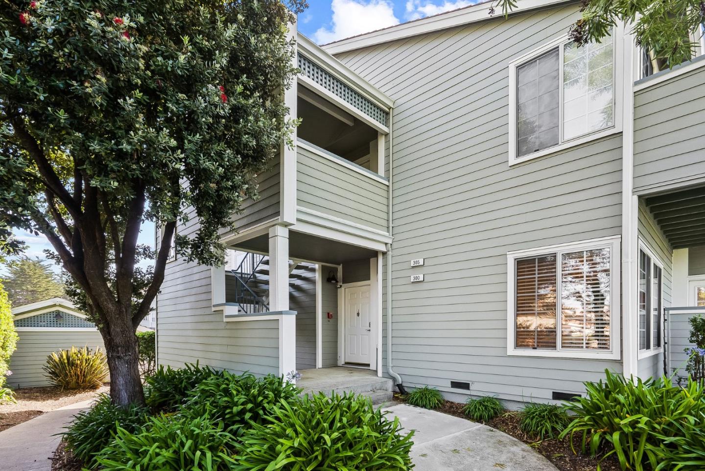 300 Troon Way Half Moon Bay, CA 94019 - Photo 2 of 50 a front view of a house with garden