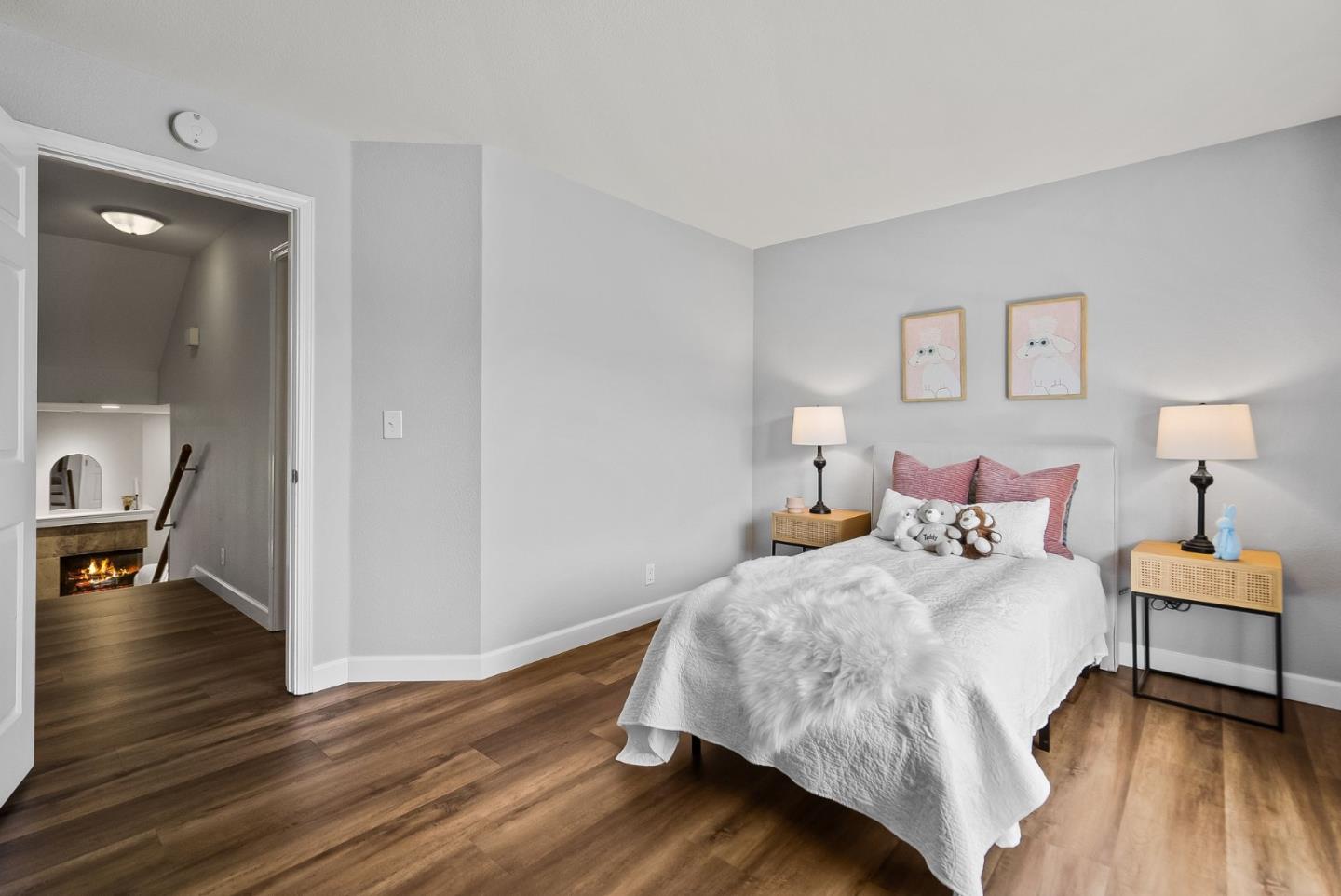 300 Troon Way Half Moon Bay, CA 94019 - Photo 26 of 50 a bedroom with a bed and wooden floor
