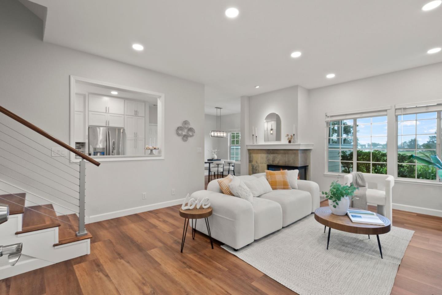 300 Troon Way Half Moon Bay, CA 94019 - Photo 8 of 50 a living room with furniture and a fireplace