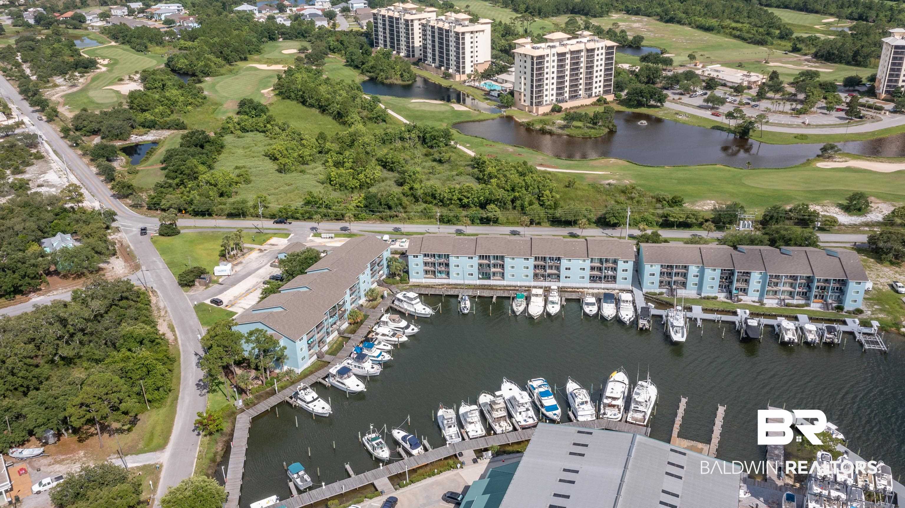 14100 River Road, Unit 327B Perdido Key, FL 32507 - Photo 42 of 46 Bird's eye view of a large body of water and a golf club