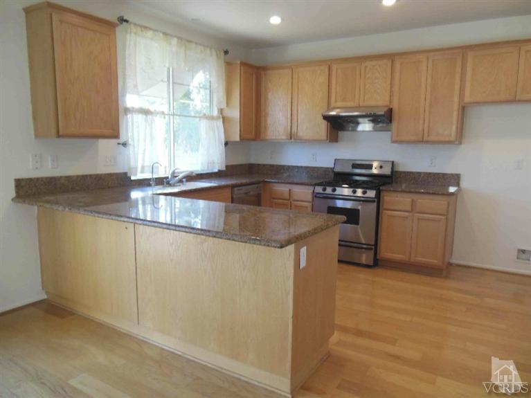 1146 Azalea Way Simi Valley, CA 93065 - Photo 11 of 22 a kitchen with granite countertop a sink and a stove