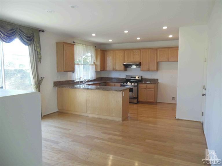 1146 Azalea Way Simi Valley, CA 93065 - Photo 12 of 22 a kitchen with stainless steel appliances granite countertop a stove a sink and a refrigerator