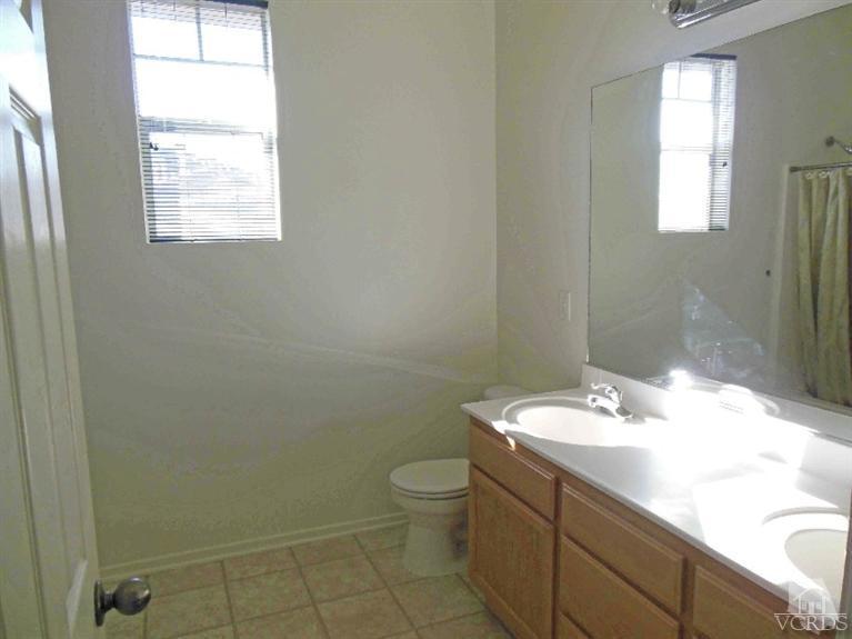1146 Azalea Way Simi Valley, CA 93065 - Photo 15 of 22 a bathroom with a sink toilet and window
