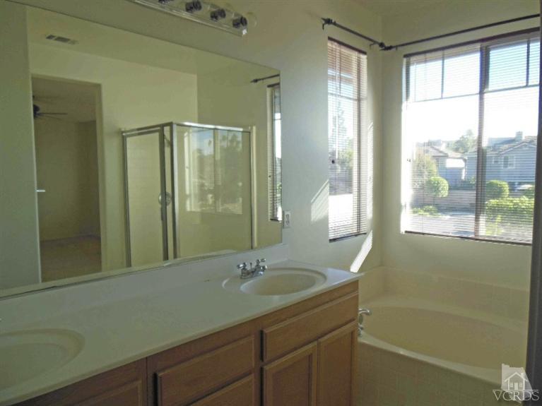 1146 Azalea Way Simi Valley, CA 93065 - Photo 19 of 22 a bathroom with a sink and a mirror