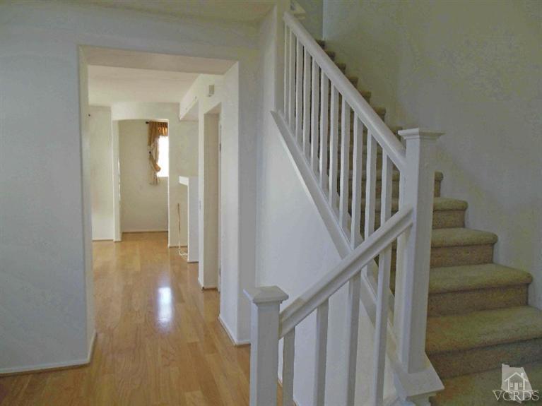 1146 Azalea Way Simi Valley, CA 93065 - Photo 7 of 22 a view of staircase with wooden floor and white walls