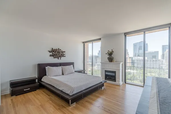 a bedroom with a bed and a fireplace