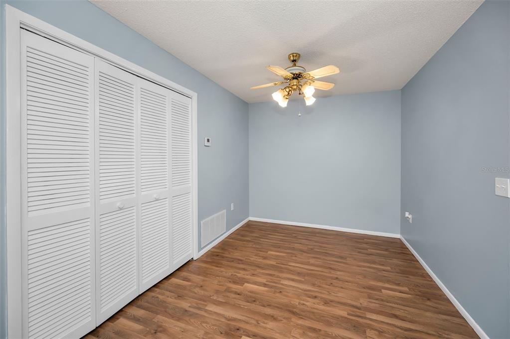 4014 Davit Drive, Unit A New Port Richey, FL 34652 - Photo 14 of 49 wooden floor in an empty room