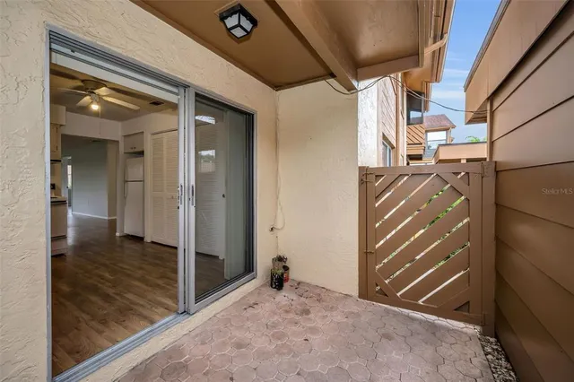 a kitchen with granite countertop a sink cabinets and stainless steel appliances