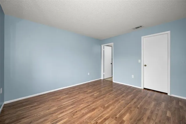 a view of an empty walk in closet