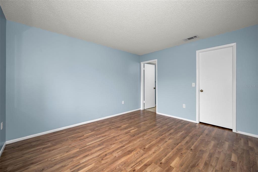 4014 Davit Drive, Unit A New Port Richey, FL 34652 - Photo 25 of 49 a view of an empty room with wooden floor