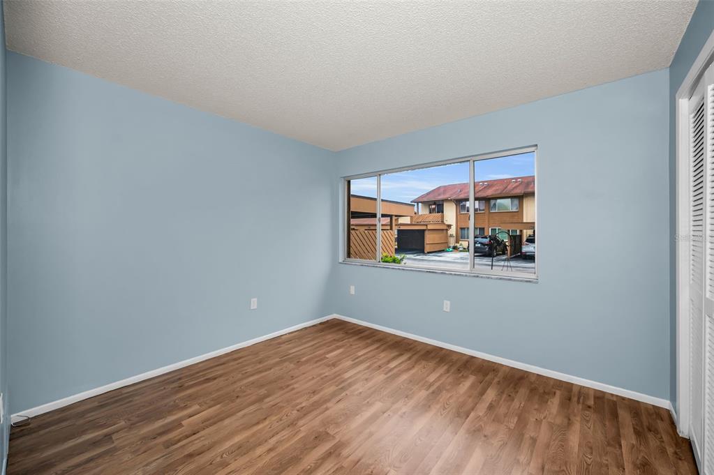 4014 Davit Drive, Unit A New Port Richey, FL 34652 - Photo 28 of 49 a view of empty room with wooden floor and fan