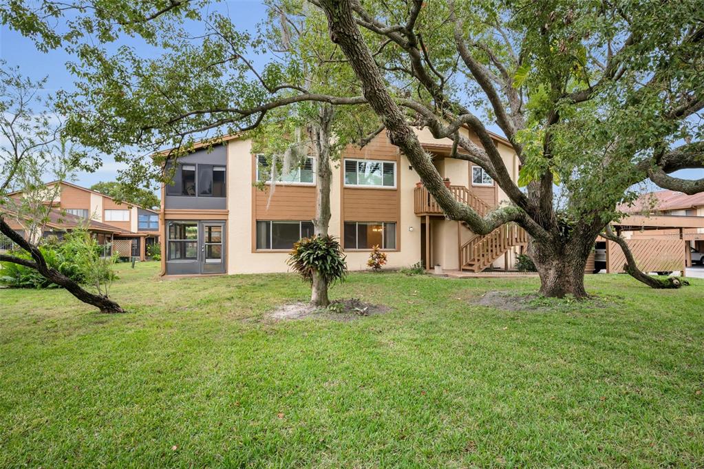 4014 Davit Drive, Unit A New Port Richey, FL 34652 - Photo 3 of 49 a house view with a garden space