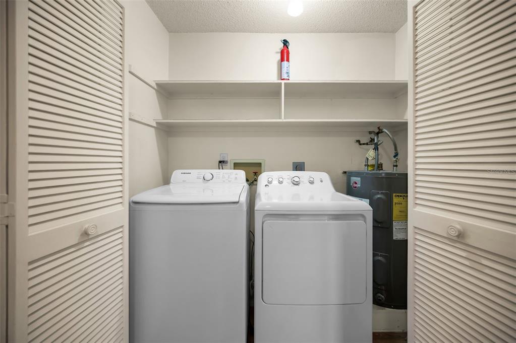 4014 Davit Drive, Unit A New Port Richey, FL 34652 - Photo 31 of 49 a utility room with dryer and washer