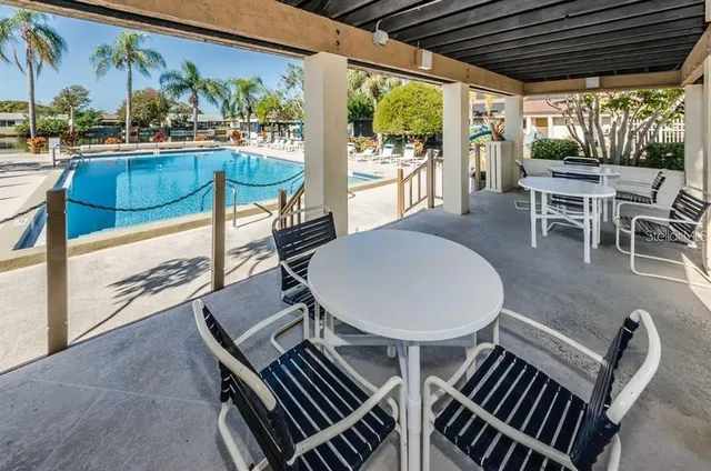 a view of a patio with swimming pool