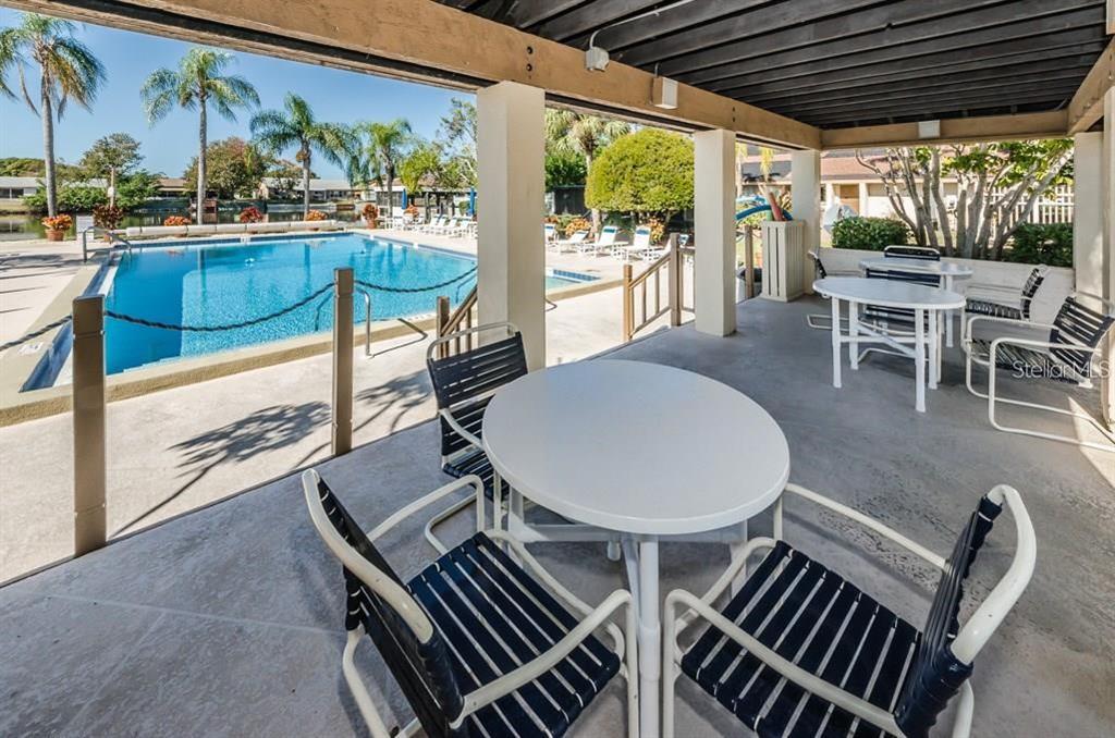 4014 Davit Drive, Unit A New Port Richey, FL 34652 - Photo 44 of 49 a outdoor dining space with furniture and outdoor view