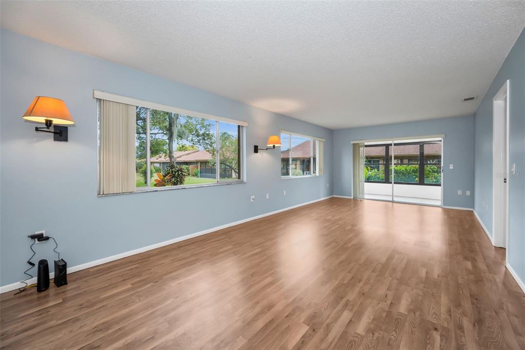 4014 Davit Drive, Unit A New Port Richey, FL 34652 - Photo 6 of 49 a view of an empty room with wooden floor and a window