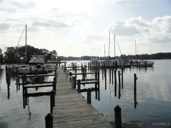a view of a lake with boats and trees