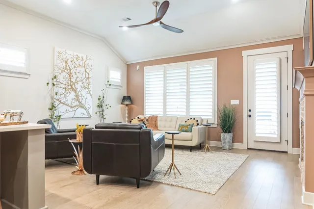 a living room with furniture a table and a window
