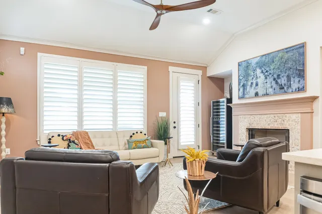 a living room with furniture and a fireplace
