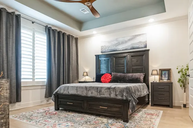 a bedroom with bed and window