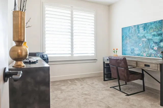 a workspace with furniture and a window