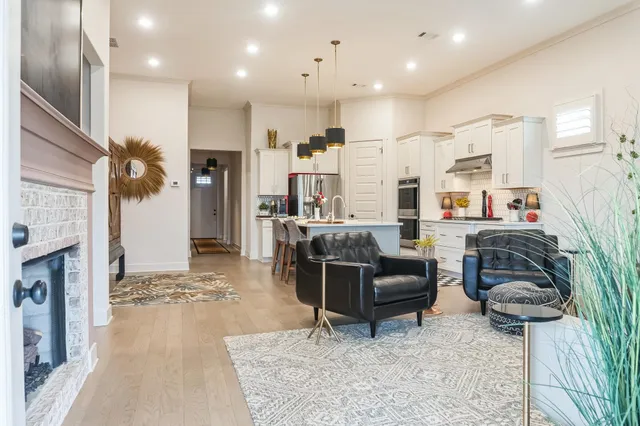 a living room with furniture and a fireplace