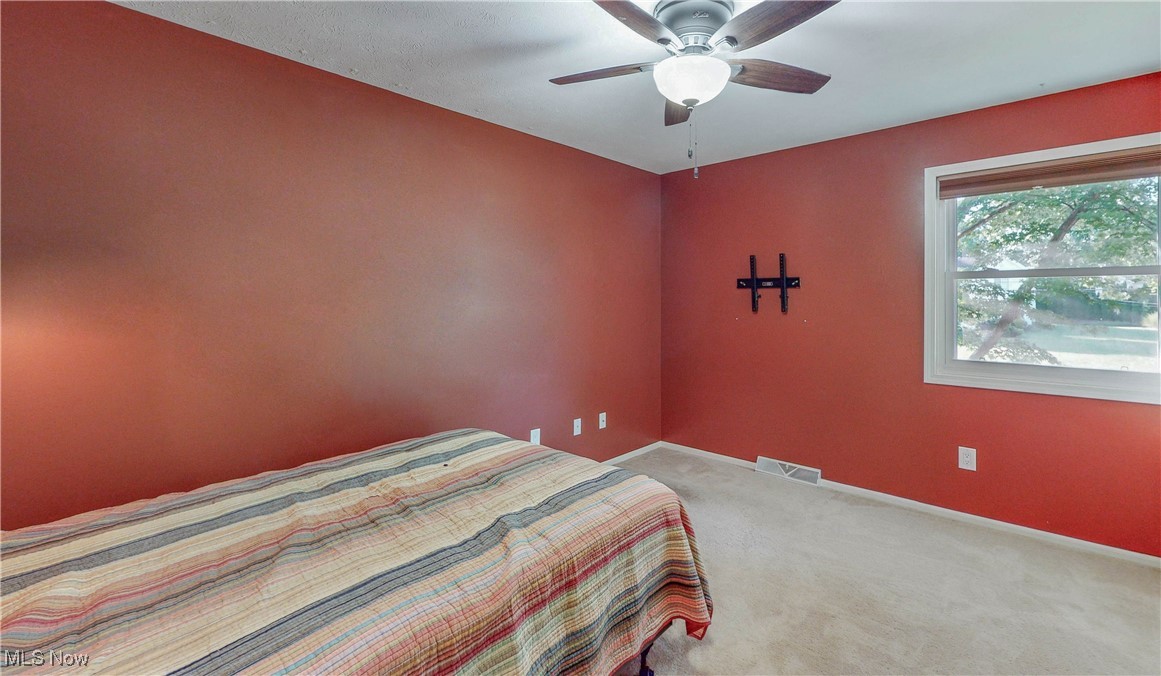 3491 Kent Road Stow, OH 44224 - Photo 23 of 40 Bedroom # 2 with ceiling fan, window and carpet