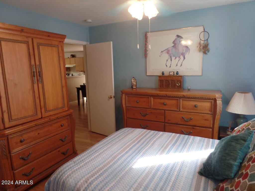1873 West Renaissance Avenue Apache Junction, AZ 85120 - Photo 11 of 18 a bedroom with a bed and a dresser