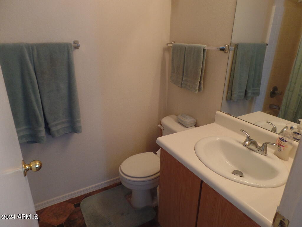 1873 West Renaissance Avenue Apache Junction, AZ 85120 - Photo 12 of 18 a bathroom with a sink toilet and shower