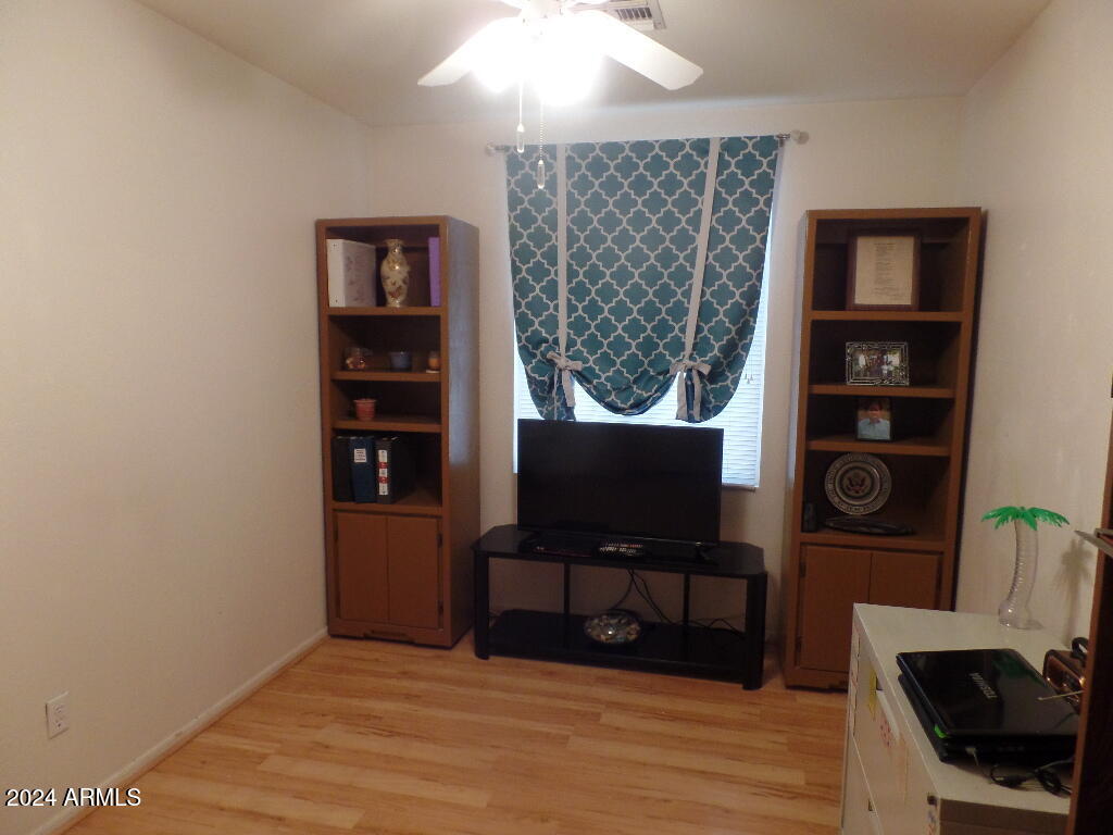 1873 West Renaissance Avenue Apache Junction, AZ 85120 - Photo 14 of 18 a view of a workspace with furniture and wooden floor
